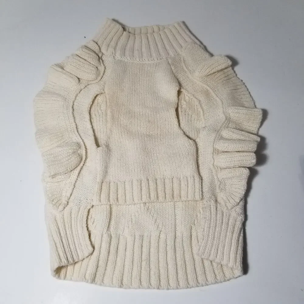 small girl doggie light sweater  one small faint stain on underside of sweater